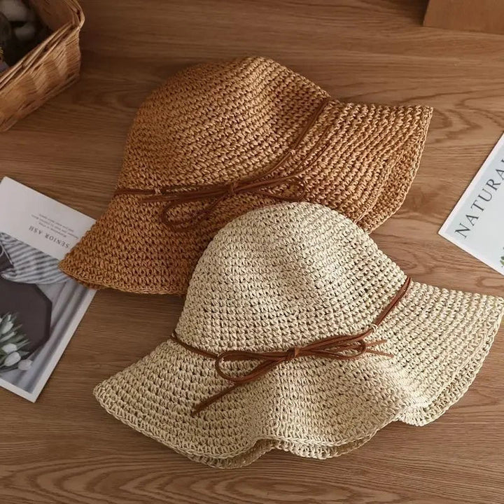 Roze Tessa zomerhoed voor dames, beschermt tegen UV en is een elegant accessoire voor elke vakantie.