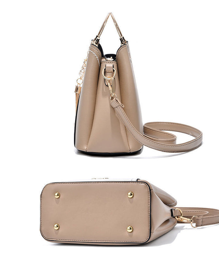 Veelzijdige dames handtas van PU leer; draagbaar als schouder-, hand- of crossbodytas.