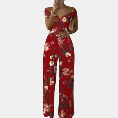 "Stijlvolle dames jumpsuit met blauwe print, elegante snit en stretchmateriaal voor comfortabele, flatterende pasvorm."