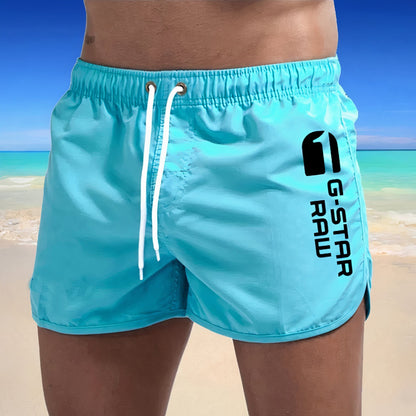 "Stijlvolle heren zwembroek Arch, sneldrogend, blauwgroene tint, elegant ontwerp, comfortabele pasvorm voor zomeravonturen."