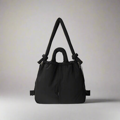 "Stijlvolle puffer handtas in beige met ruim design en comfortabele handgrepen voor vrouwen, perfect voor dagelijks gebruik."