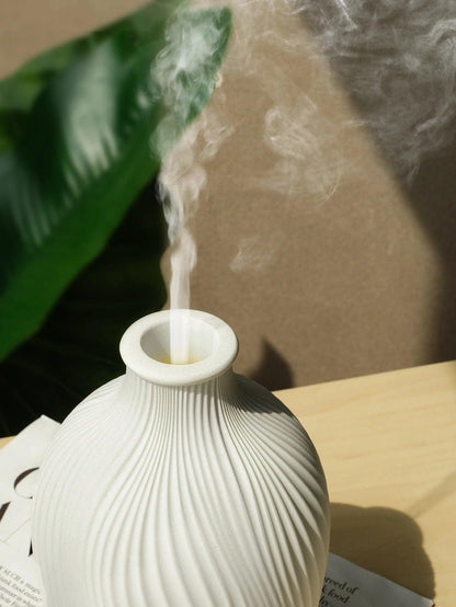 "Stijlvolle ultrasone aroma diffuser in vaasvorm, bohemian stijl, creëert rust en esthetiek in moderne interieurs."