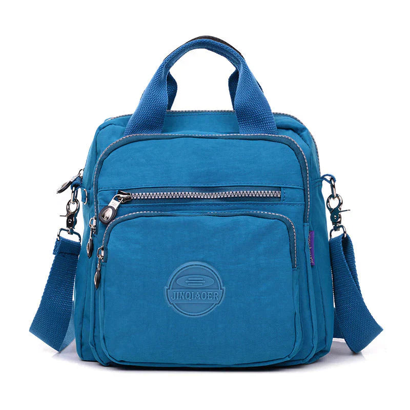 "Stijlvolle waterdichte nylon rugzak dames, elegante lagen, verkrijgbaar in blauw, groen en meer voor ultieme bescherming."
