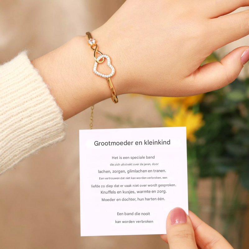 Liefdevol sieraad: verstelbare dames infinity hart armband, witgoud/goud. Symbool voor oneindige liefde.