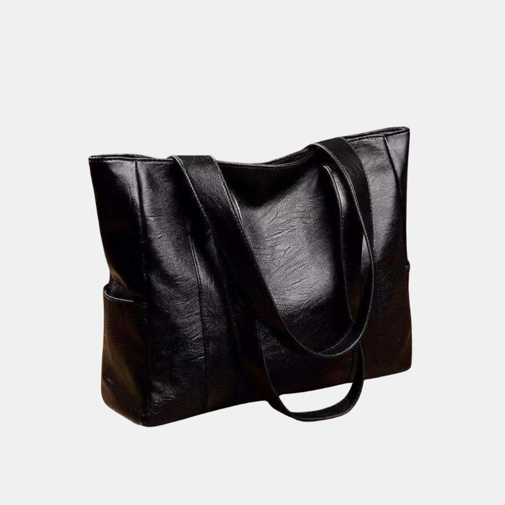 Dames vintage schoudertas in zwart leer, elegant en tijdloos, perfect als dagelijkse handtas of mode-accessoire.