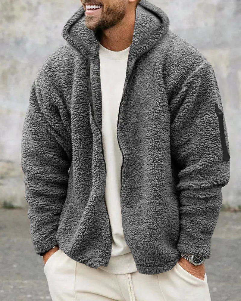 Modieus heren bomberjack met oversized pasvorm en capuchon, casual gedragen voor een trendy herfstlook.