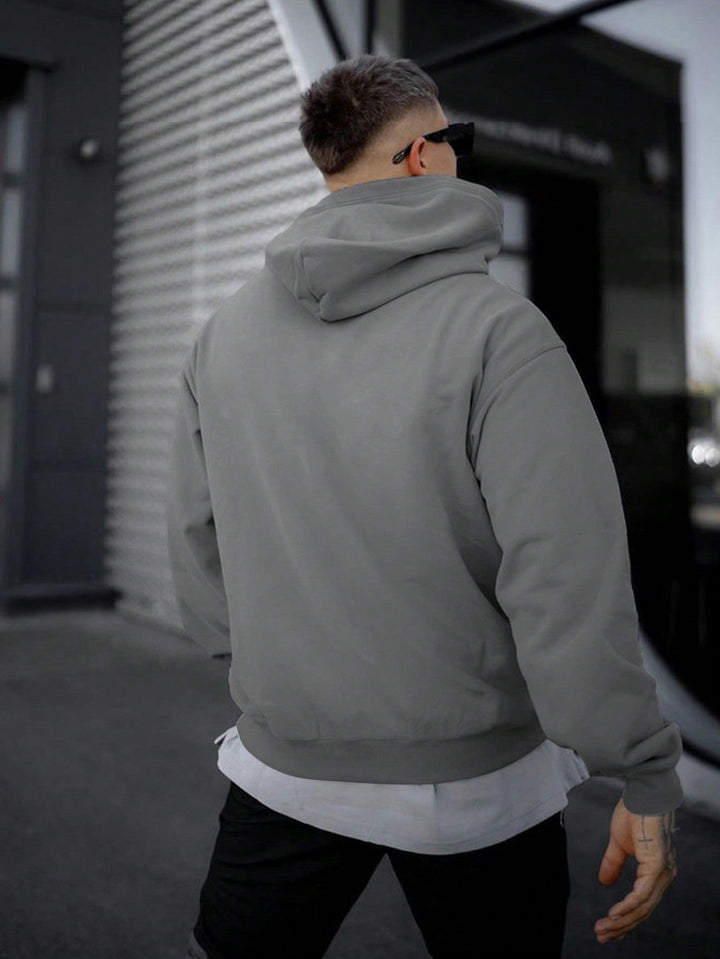 Comfortabele oversized heren hoodie met capuchon, ideaal voor een relaxte lente of herfst look.