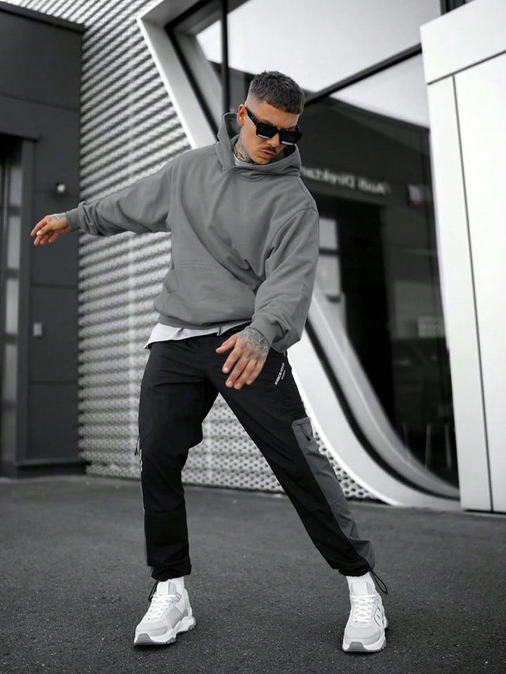 Trendy oversized heren hoodie, streetwear casual mode voor mannen, veelzijdig en comfortabel.