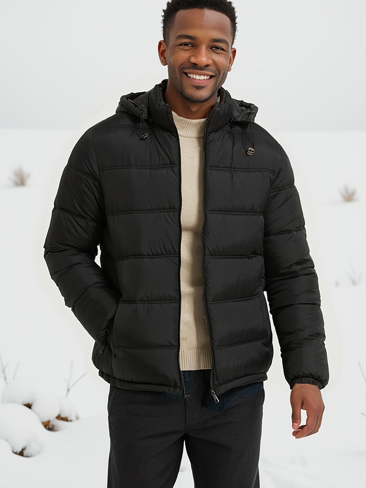 Zwarte elegante heren pufferjas met capuchon en praktische zakken, ideaal voor winter en herfst, warm en stijlvol.