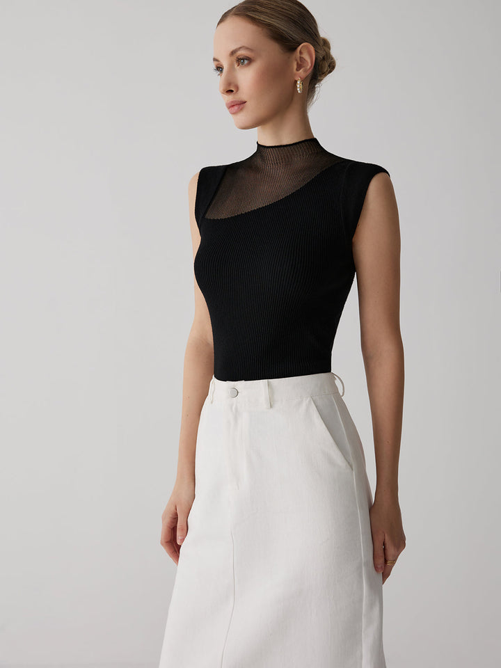 Elegante dames top, mouwloos, met ribbelpatroon en hoge kraag. Comfortabel getailleerd.