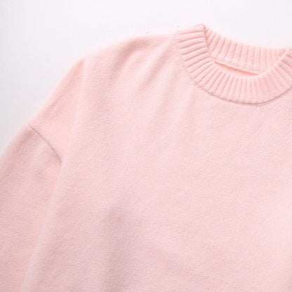 "Trendy oversized sweater in zachtroze met losse pasvorm, ideaal voor herfst en winter, perfect voor jeans en leggings."