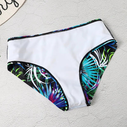 "Tropische high-waist bikini met levendig patroon, flatterende pasvorm, verstelbare bandjes, ideaal voor zonnige stranddagen.