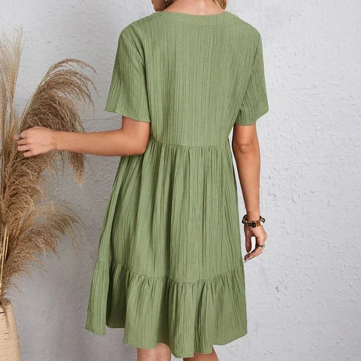 Comfortabele retro V-hals jurk voor dames, corrigerend en afslankend effect. Perfect voor lente/zomer.
