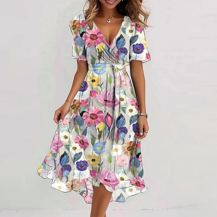 Muller damesjurk met verfijnde bloemenprint en V-hals. Modieus en comfortabel, een veelzijdige keuze voor de zomer.