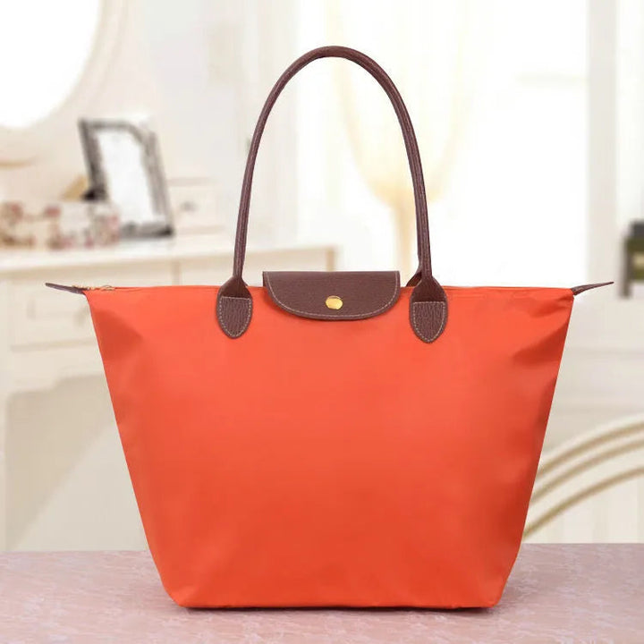Stijlvolle dames tas in oxfordstijl, een modern accessoire dat mode en functionaliteit combineert.