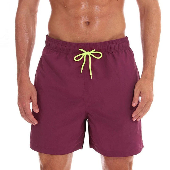 Moderne heren zwemkleding, sneldrogende stof en trendy design voor de ultieme strandmode-ervaring.