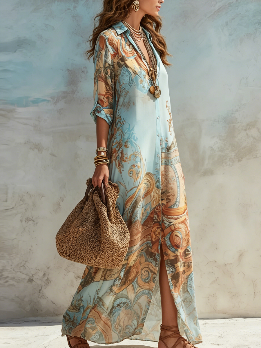 Trendy blauwe dames blousejurk met driekwartmouw en levendige paisleyprint; ideaal voor casual en elegante looks.