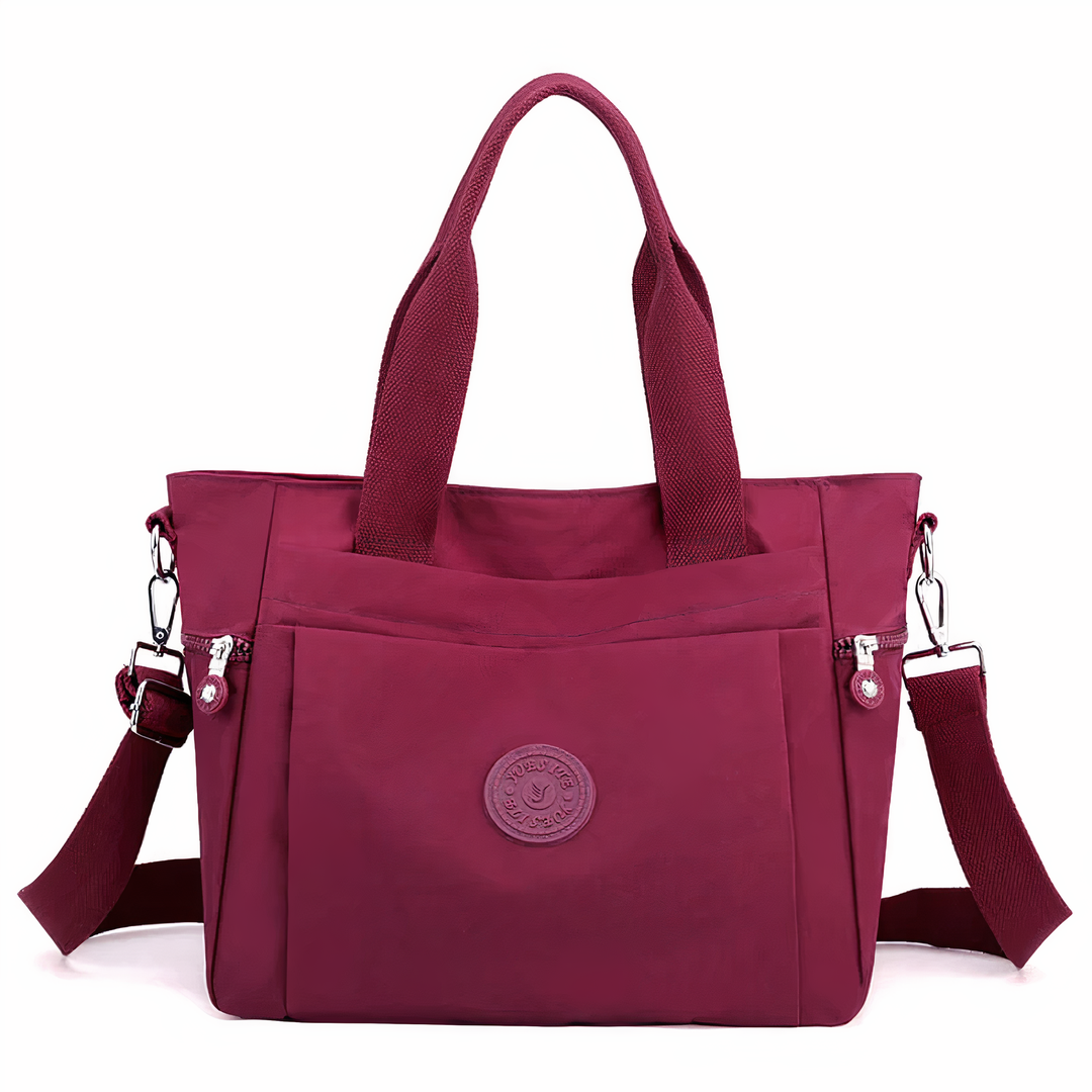 Duurzame dames nylon handtas, waterdicht met ruime compartimenten. Een stijlvolle en betrouwbare dagtas voor elke vrouw.