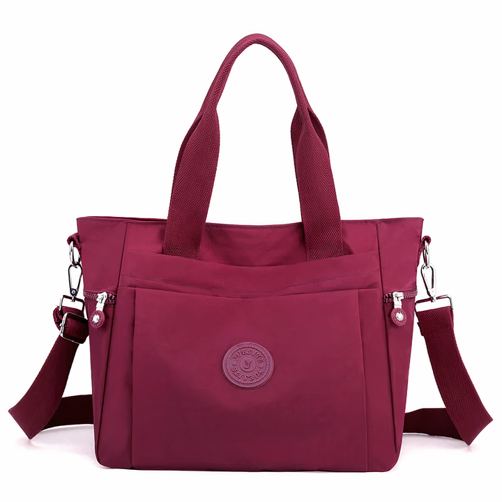 Duurzame dames nylon handtas, waterdicht met ruime compartimenten. Een stijlvolle en betrouwbare dagtas voor elke vrouw.