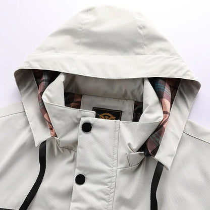 "Waterdichte tactische jas voor mannen, elegant ontwerp, ideaal voor avontuur en stijl, donkergrijs met meerdere zakken."
