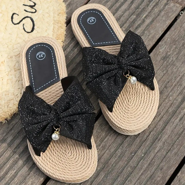 Trendy dames slippers met strikjes, elegant en comfortabel, de perfecte aanvulling op je zomeroutfit.