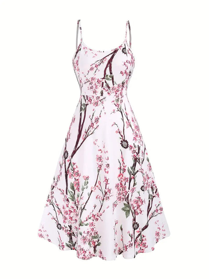 Elegante tweedelige dames zomeroutfit met vrolijke bloemenprint, ideaal voor strand, feest of casual chic.