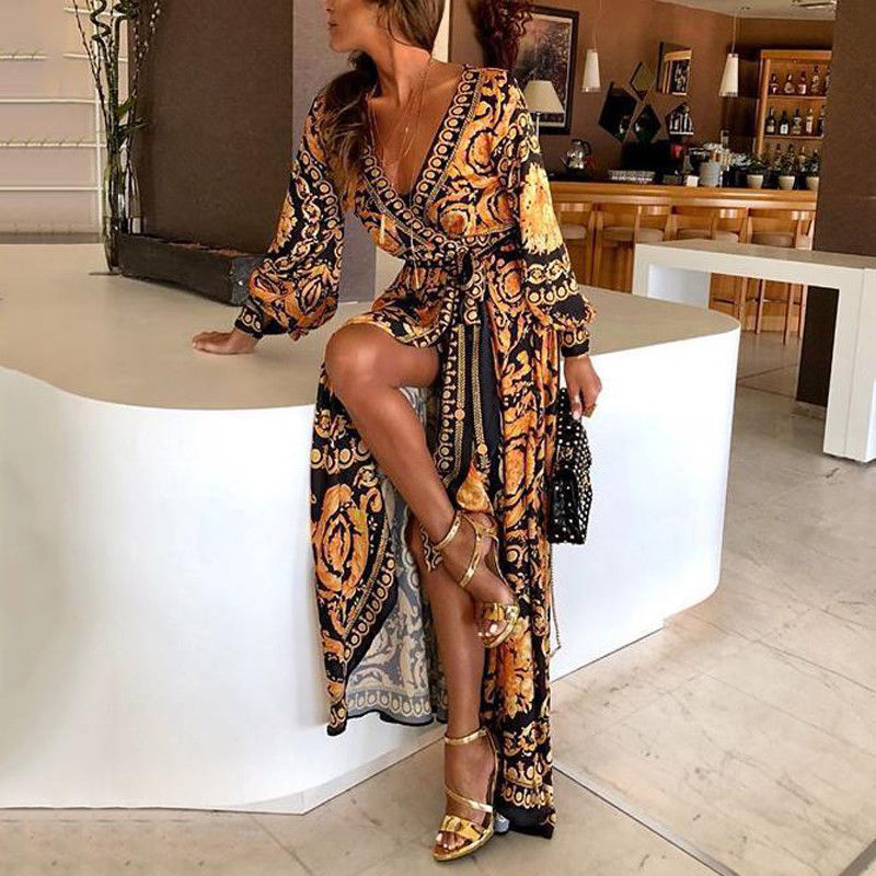 Dames oranje wikkeljurk met split, v-hals, lange mouwen. Perfecte zomerse boho maxi jurk voor strand of feest.