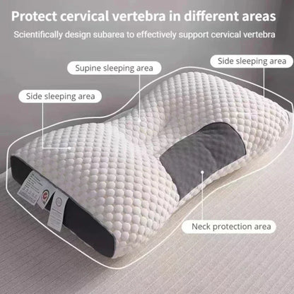 "Wit orthopedisch hoofdkussen met grijze accenten, ademend soja vezel, massagefunctie voor nek- en schouderondersteuning."