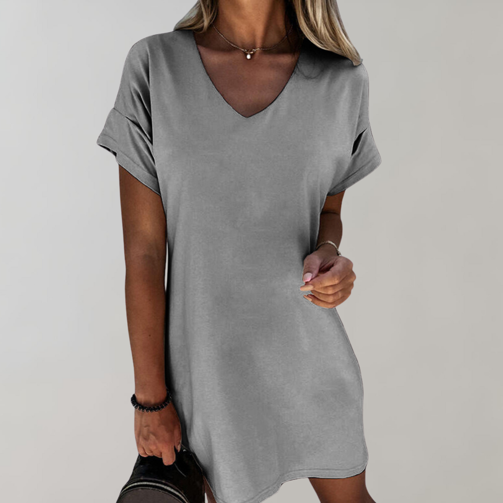 "Witte dames zomerjurk met wijde mouwen, casual en luchtig ontwerp, ideaal voor lente en zomerdagen."