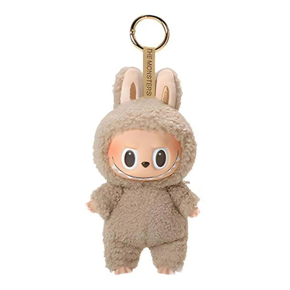 Klein pluche monstertje sleutelhanger, schattig en opvallend, ideaal tasaccessoire.