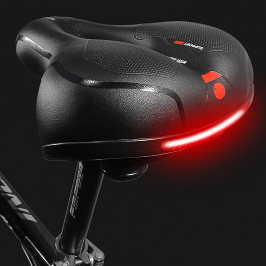 "Zwart ergonomisch fietszadel met universele pasvorm, schokabsorberende vering en comfortabel PE schuim voor lange ritten."