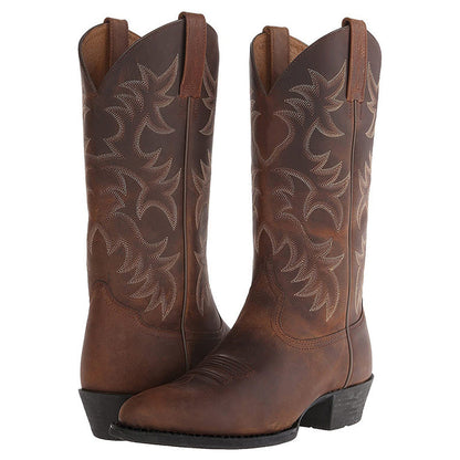 "Zwarte en bruine heren cowboylaarzen van rundleer met spitse neuzen en stijlvolle stiksels voor een klassieke western look."