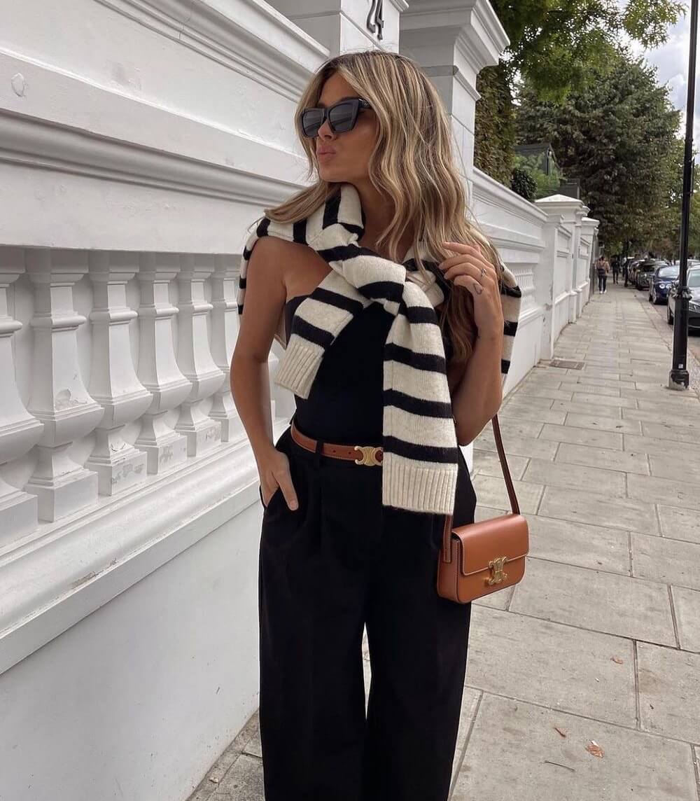 "Zwarte luxe leren riem met gouden gesp, veelzijdig voor casual en formele outfits, elegant en stijlvol accessoire."